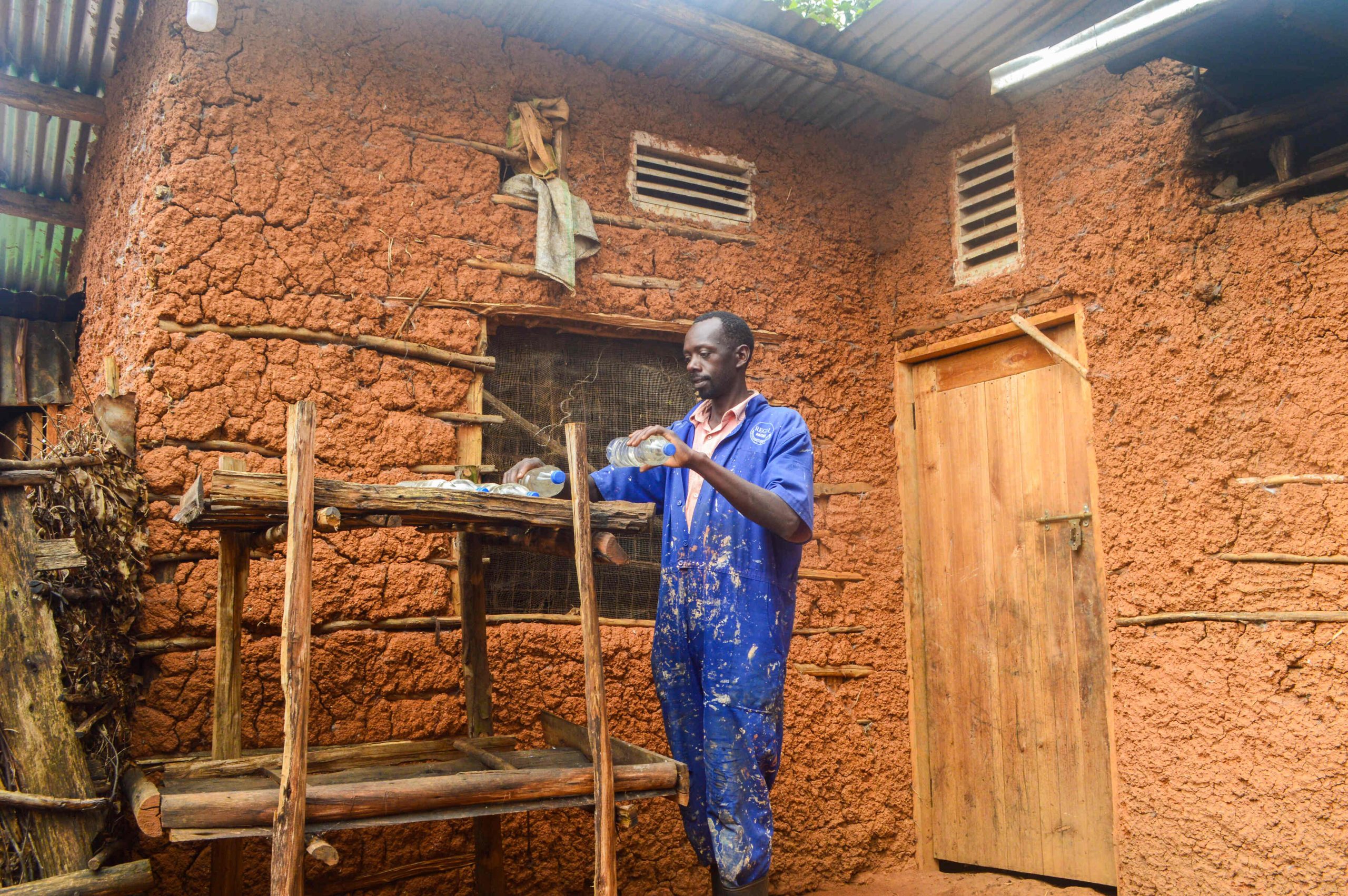 Brian placing SODIS bottles on a rack