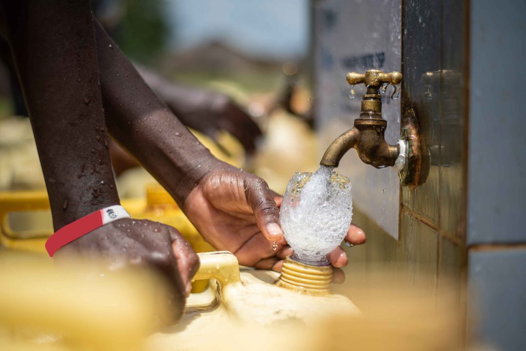 A girl fetching water from a psp