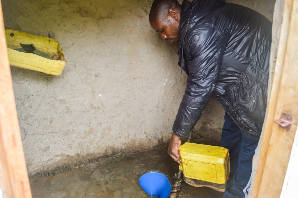 Gad cleaning his latrine