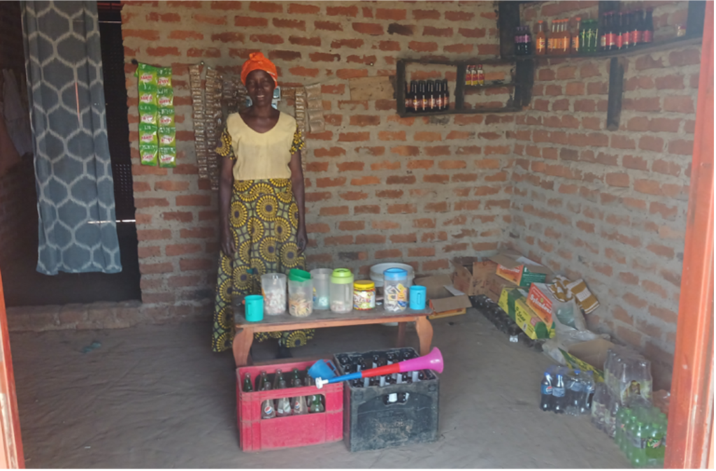 Mary stands infront of her shop items