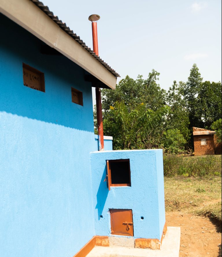 An incinerator at the back of the VIP latrine