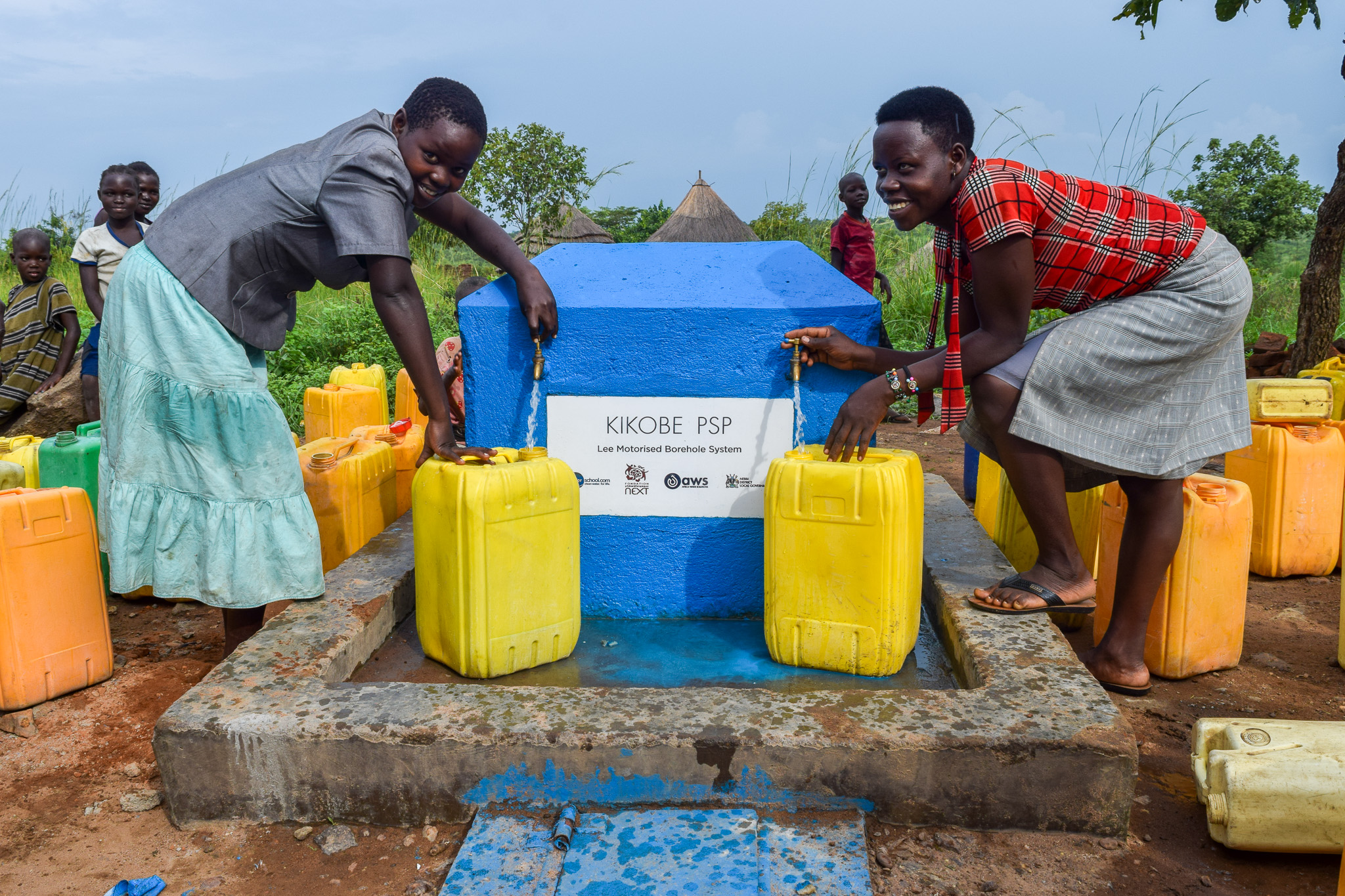 Community members fetch water from Kikobe psps
