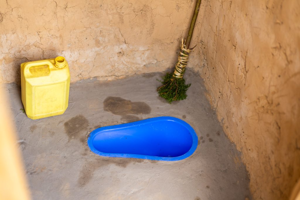 A newly installed SATO pan in Ponsiano's latrine