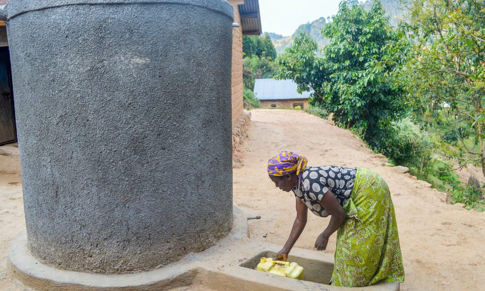 Boniconcilla fetching water from a RWH tank